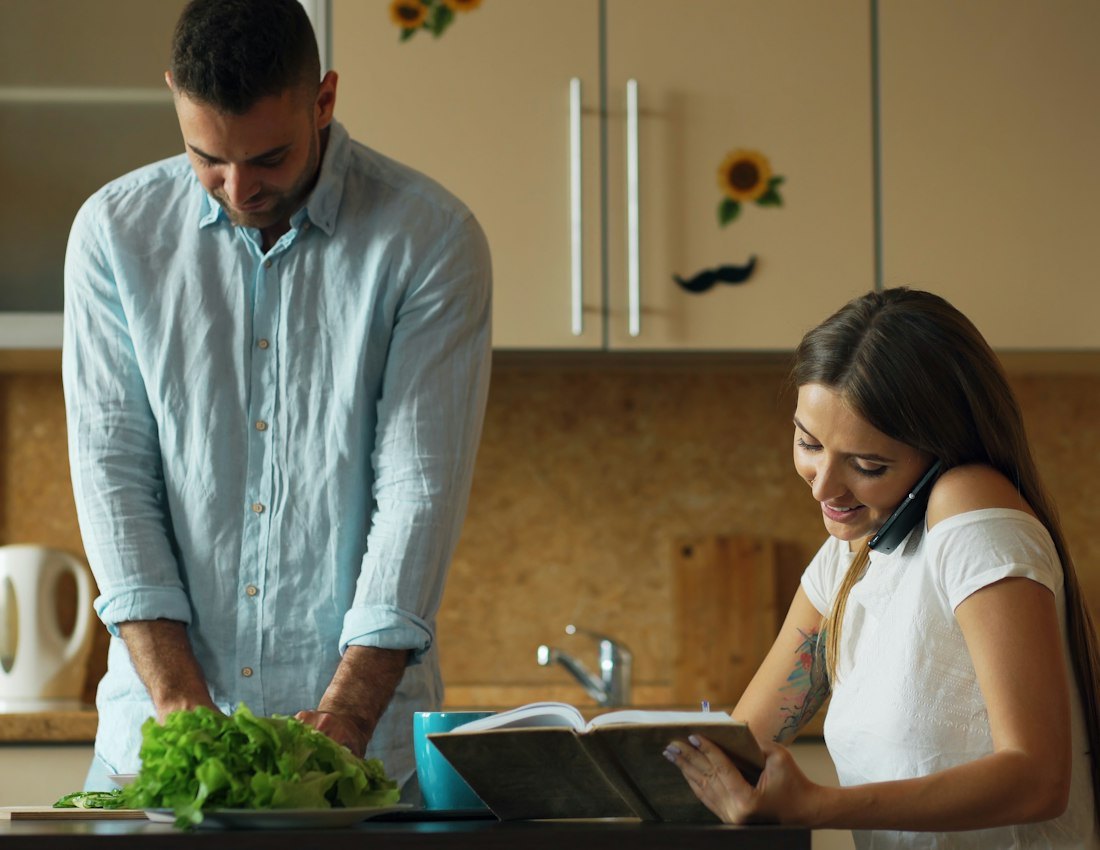 Couple preparing a fresh salad together